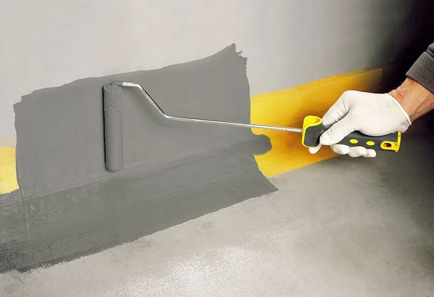 Applying waterproofing mastic with a roller